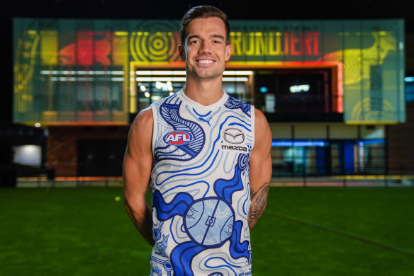 High five: North Melbourne co-captain Jy Simpkin, in the jumper which bears traditional totems, has pledged his long-term future to the Kangaroos.