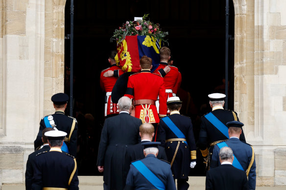 Pallbearers carry the coffin of Queen Elizabeth II into St George’s Chapel.