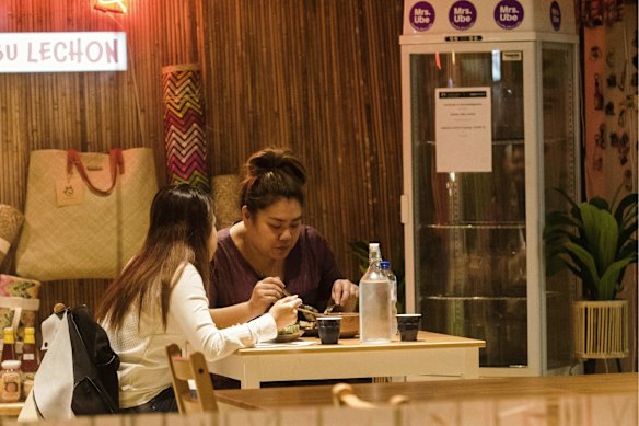 Diners eat out on the first night of eased lockdown conditions in Newtown.