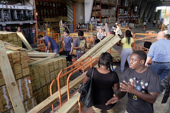 Customers at a Home Depot buy wood to secure their property in Miami in anticipation of Hurricane Irma early on Friday.