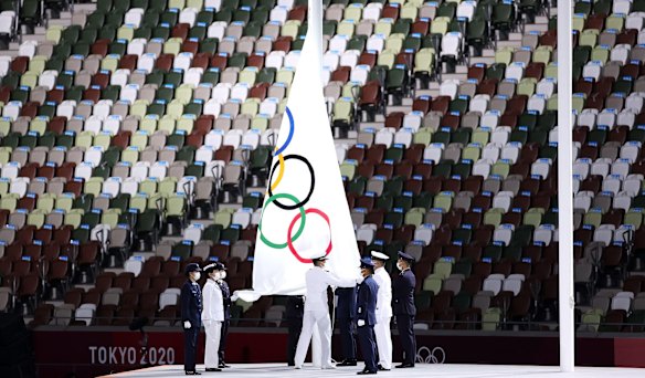 The olympic flag is lowered during the Closing Ceremony of the Tokyo 2020 Olympic Games at Olympic Stadium in Tokyo, Japan. 