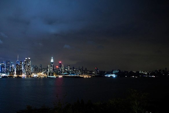 Much of the New York City skyline sits in darkness after Hurricane