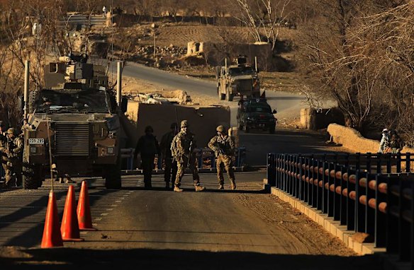 Australian soldiers patrol and search the Puza Bridge for IED's after an insurgent was arrested the night before with explosive matieral at this location. Dai Roshan Area in Uruzgan Province, Afghanistan.