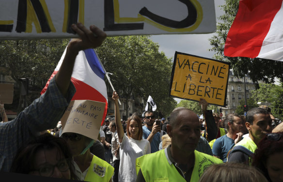 A protestor holds a sign which reads “vaccine to freedom” during a demonstration in Paris on Saturday.