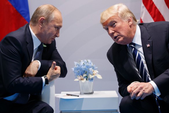 President Donald Trump meets with Russian President Vladimir Putin at the G-20 Summit in Hamburg on July 7, 2017. Trump signed on August 2 what he called a "seriously flawed" bill imposing new sanctions on Russia, pressured by his Republican Party not to move on his own toward a warmer relationship with Moscow in light of Russian actions.