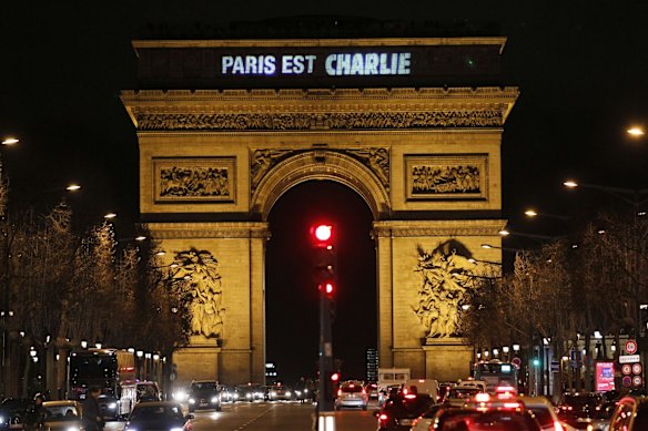 The message "Paris is Charlie" is projected on the Arc de Triomphe in Paris.