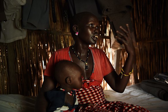 Martha Nyambol, 28, with her 7 month old baby Nyall Koang in her shelter inside the UN Bentiu Protection of Civilians (POC) site, Bentiu, Unity State, South Sudan. 