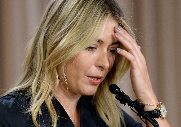 Maria Sharapova reacts as she addresses the media.