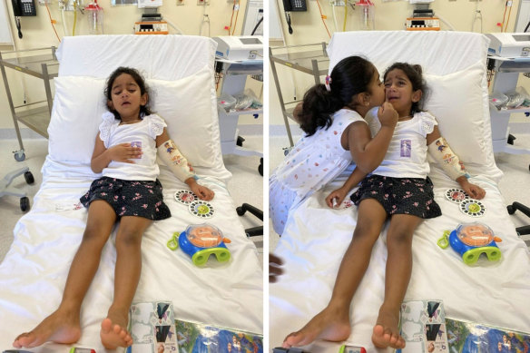 Tharnicaa and her sister Kopika in hospital on Christmas Island on June 6.