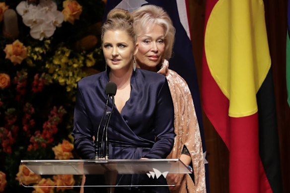Sophie Taylor-Price delivers a eulogy at the state memorial service for her late grandfather Bob Hawke at the Sydney Opera House on Friday, supported by Mr Hawke's widow Blanche D'Alpuget. 