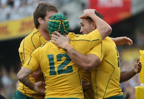 Quade Cooper is congratulated after his try.