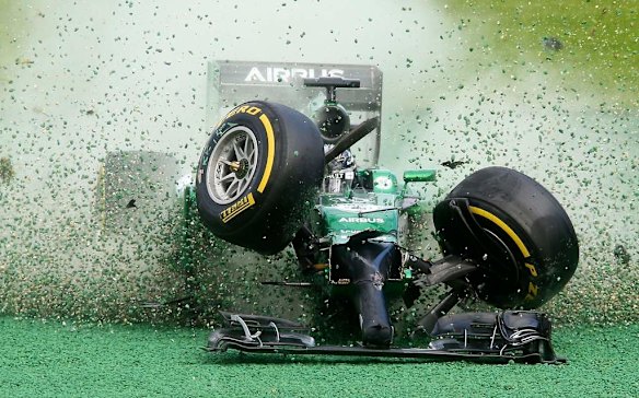 Caterham driver Kamui Kobayashi crashes in the first corner.