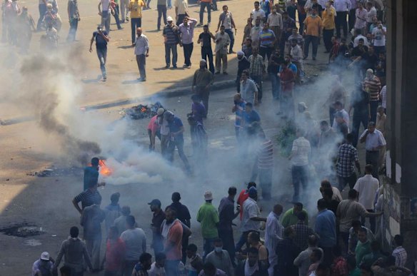 Supporters of Egypt's ousted President Mohammed Morsi clash with security forces near the largest sit-in by supporters of Morsi in the eastern Nasr City district of Cairo, Egypt.