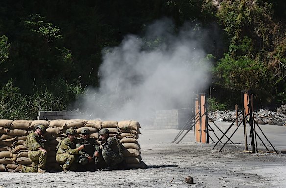 Australian Army Sergeant Steve Driver (left) and Sapper Nicholas Field (2nd from left) with the 2nd Combat Engineer Regiment.