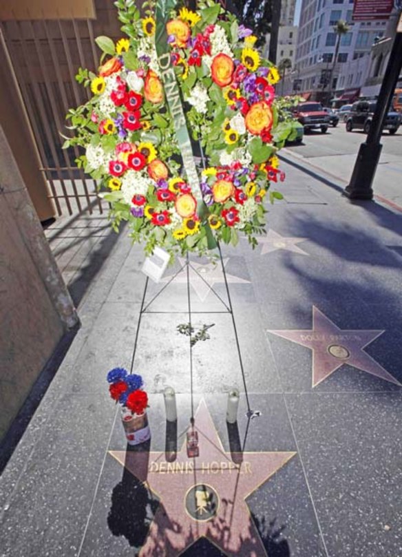 Flowers and mementoes adorn the star of Dennis Hopper on the Hollywood Walk of Fame on May 29, 2010.  Hopper died Saturday at the age of 74. 