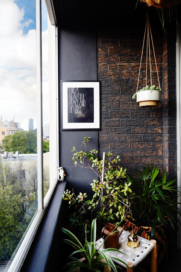 The balcony, with views of the Melbourne skyline, is filled with plants. 'Having an outdoor room, however tiny, makes the apartment feel much more spacious.'