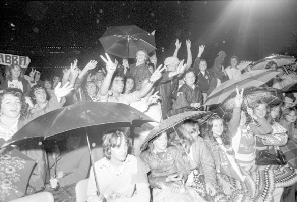 Fans brave the rain at the ABBA concert at Sydney Showground, 3 March 1977.
