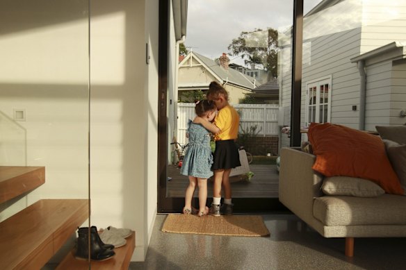 Sisters Grace and Florence comfort each other.