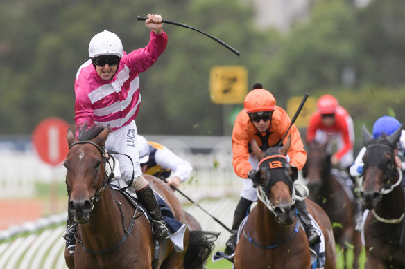 Blooming marvelous: Christian Reith salutes as Dixie Blossoms passes the post in the Coolmore Classic.