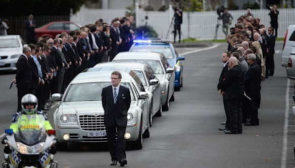 Funeral of Chris Lane at Saint Thereses Parish Church in Essendon , a guard of honour for Chris as the casket leaves the church