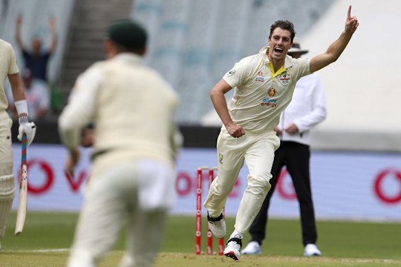 Australia's Pat Cummins celebrates taking the wicket of England's Haseeb Hameed.