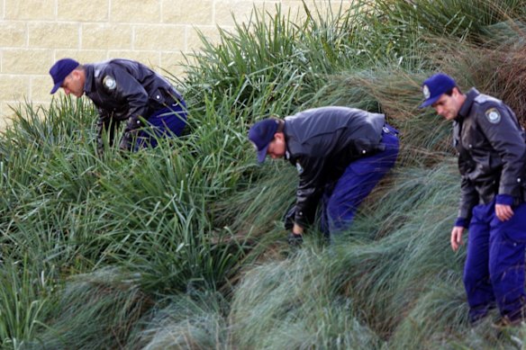 High security as Ivan Milat gives evidence at coronal inquiry at Toronto courthouse. Police check court garden before Milat arrives.