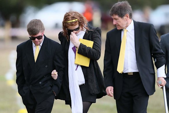 Friends and family arrive for the service.