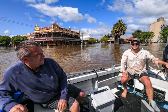 Victor Jones and son Michael on their way to evacuate Victor's brother in law Rob Ives from his home next to the river.
