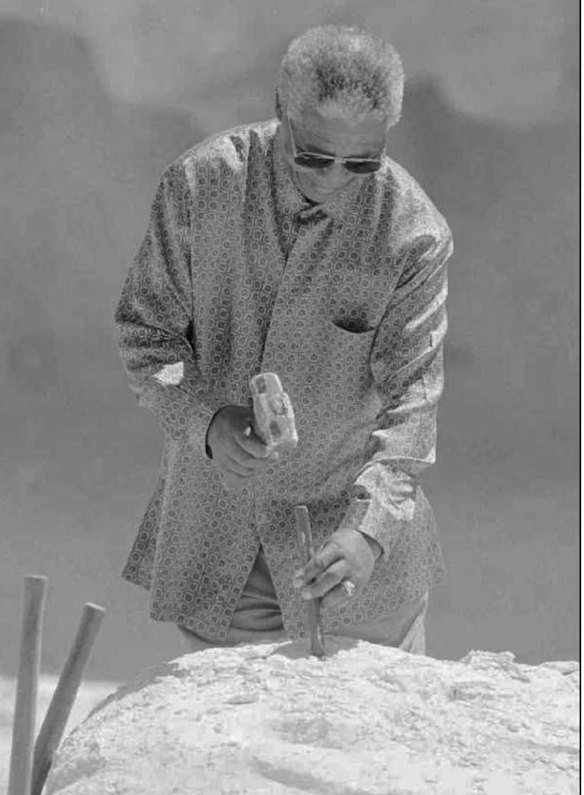 South African President Nelson Mandela chips away at limestone in a quarry on Robben Island  1995 as he did so when imprisoned there.