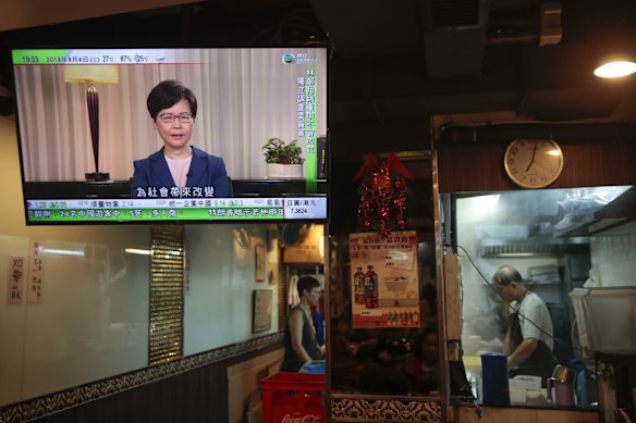 Hong Kong Chief Executive Carrie Lam makes an announcement on an extradition bill in television message, seen at a restaurant in Hong Kong, on Wednesday, Sept. 4, 2019. 