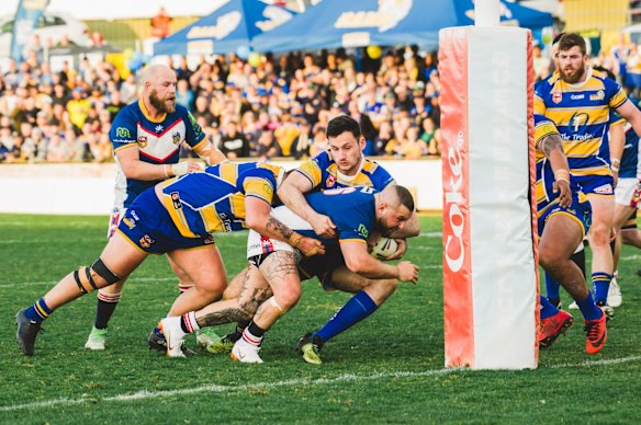 Tuggeranong Bushrangers Jamal Nchouki scores a try.
