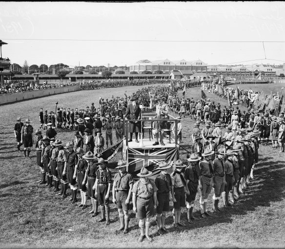 Lord and Lady Baden Powell standing on a platform in the middle of a scout formation, new South Wales, 1931 