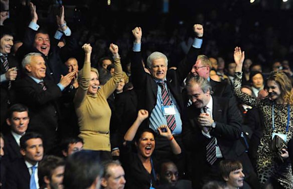 The Russian delegation celebrate being named host nation for 2018.