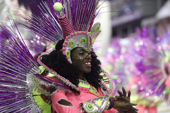 A dancer from the Vai-Vai samba school performs during a carnival parade in Sao Paulo, Brazil, Sunday.