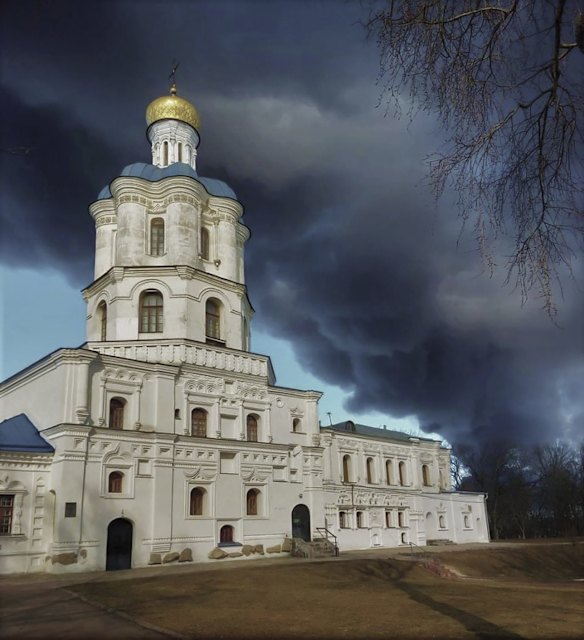 Smoke rises behind Chernihiv Orthodox Collegium in Chernihiv, Ukraine.