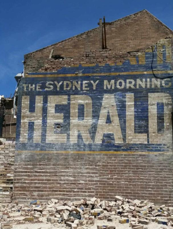 A hand-painted sign for The Sydney Morning Herald was uncovered by a demolition crew in Campsie.