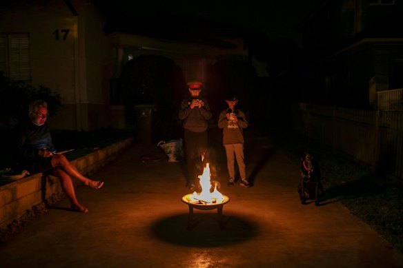 Chris Latchfrord with his son Saxon and daughter Ginger before dawn service on ANZAC day.