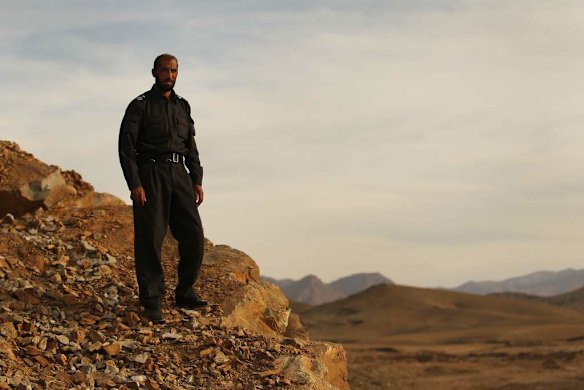 Uruzgan Police Chief, Matiullah Khan, stands on a mountain ridge overlooking the Uruzgan landscape in the Sagi area, Tarin Kowt district, Uruzgan, Afghanistan.