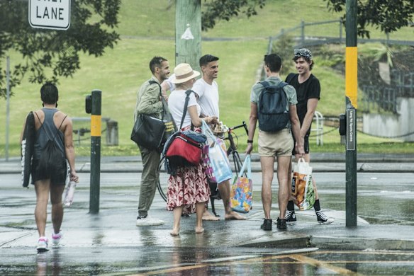 Picnics are packed up as the rain begins to fall at Centennial Park, as some restrictions ease.