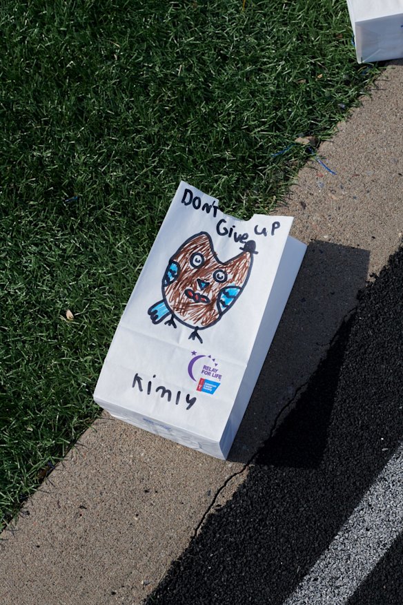 Track side tributes at Tartan High for cancer victims and survivors.