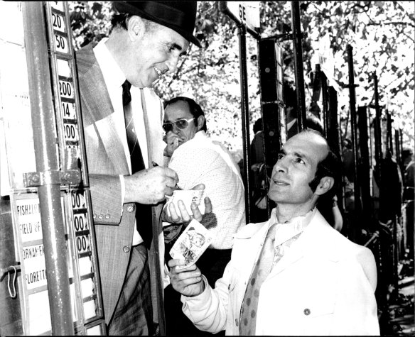 Bookmaker Bill Waterhouse, taking a bet from politician George Paciullo in May 1976, loomed large at the track.