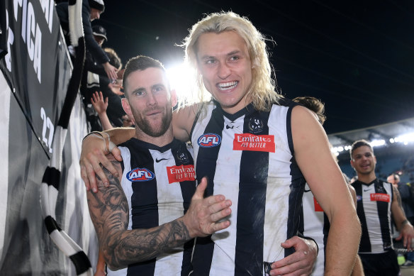 Arm in arm: Jeremy Howe and skipper Darcy Moore celebrate after the stunning win over the Giants.