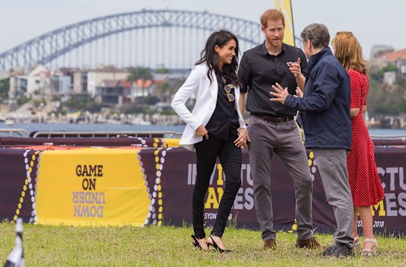 Britain's Prince Harry, the Duke of Sussex and his wife Meghan, the Duchess of Sussex are seen during the Jaguar Land Rover Driving Challenge on Day 1 of the Invictus Games on Cockatoo Island in Sydney.