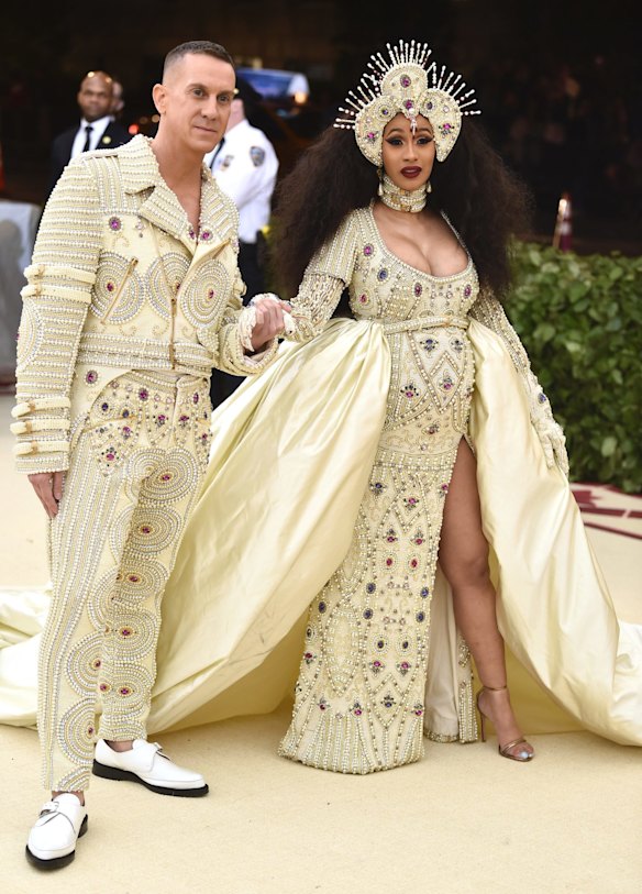 Jeremy Scott, left, and Cardi B attend The Metropolitan Museum of Art's Costume Institute benefit gala celebrating the opening of the Heavenly Bodies: Fashion and the Catholic Imagination exhibition on Monday, May 7, 2018, in New York. 