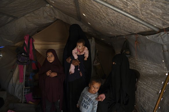 Australian's Maysa Assaad, 9 (left), Bassama Assaad (2nd from left) holding Shayma Assaad's daughter Mariam (3rd from left), Shayma Assaad's son Dawood (2nd from right) and Shayma Assaad (right) in Al-Hawl camp in North East Syria. 