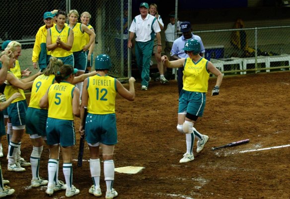The Australian softball team waiting to congratulate Peta Edebone after she hit a home run to win against China 1-0.