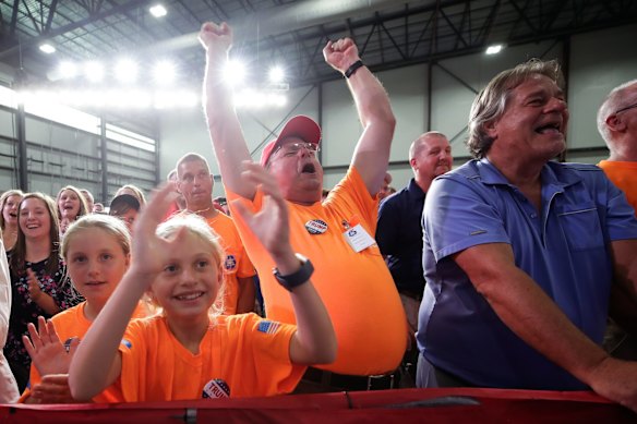 Supporters of President of the United States Donald Trump cheer as Prime Minister Scott Morrison speaks during the official opening of businessman Anthony Pratt's Pratt Industries Wapakoneta recycling and paper plant in Wapakoneta, Ohio.