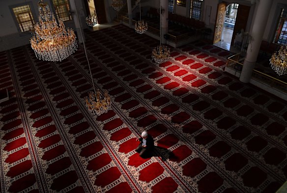 Auburn Gallipoli Mosque General Manager Ergun Genel prays alone due to the coronavirus on the first day of Ramadan. 