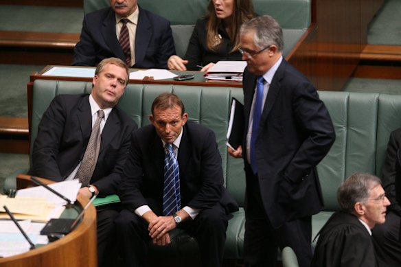 Opposition Leader Malcolm Turnbull passes Tony Abbott and Tony Smith left as he departs question time in November 2009. 