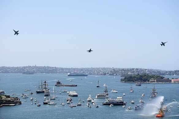 Royal Australian Air Force F/A-18A aircraft conduct a flypast over Sydney Harbour during Australia Day celebrations in Sydney.